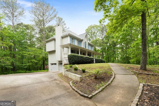 569 Hale Mountain Ct, Hiram, GA 30141 - view of front of property featuring an attached garage, a chimney, and concrete driveway