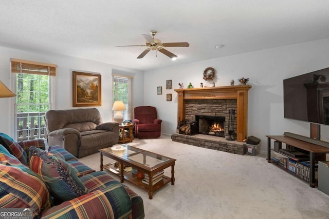 569 Hale Mountain Ct, Hiram, GA 30141 - living room with a stone fireplace, carpet flooring, and ceiling fan