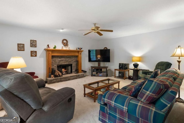 569 Hale Mountain Ct, Hiram, GA 30141 - living area with light carpet, a ceiling fan, and a stone fireplace