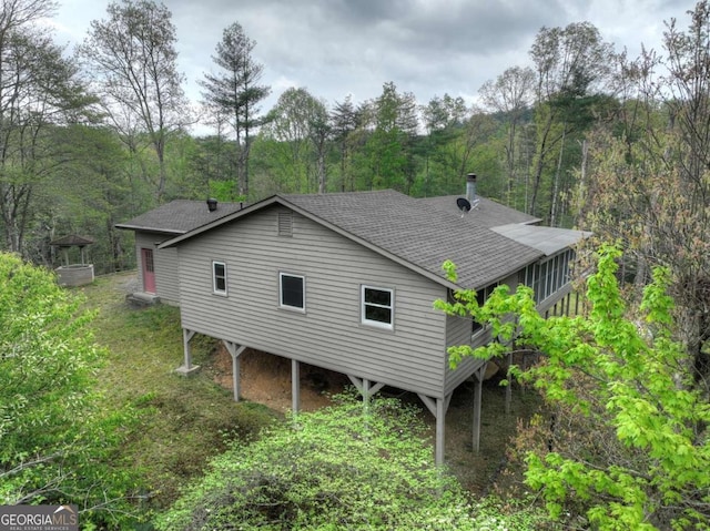 3035 Murphy Hwy, Mineral Bluff, GA 30559 - view of property exterior with a forest view and roof with shingles