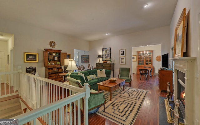 922 Brenau Point Dr, Gainesville, GA 30501 - living room featuring a fireplace with flush hearth, a chandelier, wood-type flooring, recessed lighting, and stairs