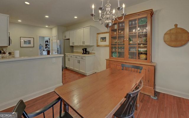 922 Brenau Point Dr, Gainesville, GA 30501 - dining space featuring baseboards, recessed lighting, wood finished floors, and a chandelier