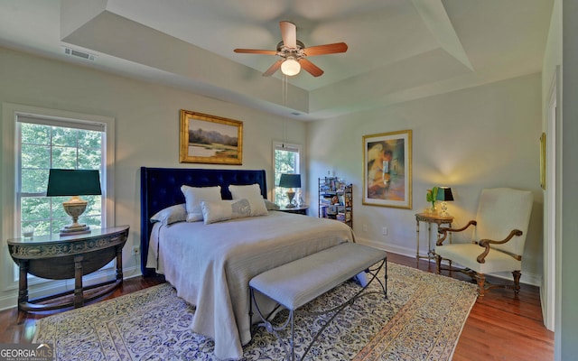 922 Brenau Point Dr, Gainesville, GA 30501 - bedroom with visible vents, baseboards, a tray ceiling, and multiple windows