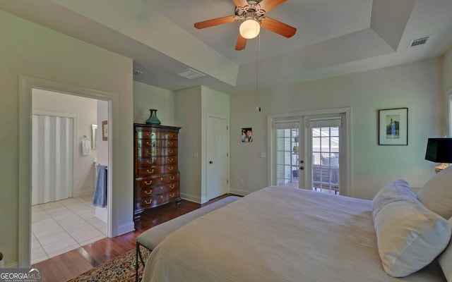 922 Brenau Point Dr, Gainesville, GA 30501 - bedroom with visible vents, wood finished floors, access to exterior, baseboards, and a raised ceiling