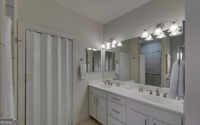 922 Brenau Point Dr, Gainesville, GA 30501 - bathroom featuring double vanity, a tile shower, a sink, and tile patterned flooring