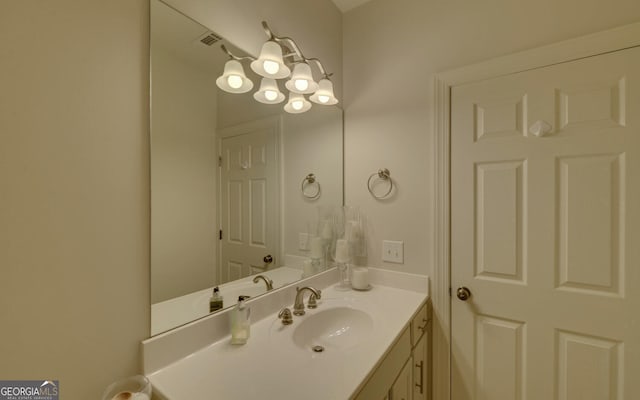 922 Brenau Point Dr, Gainesville, GA 30501 - bathroom with vanity, a chandelier, and visible vents