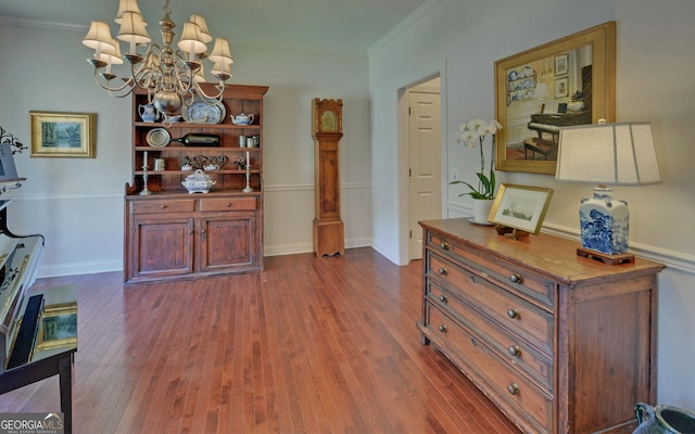 922 Brenau Point Dr, Gainesville, GA 30501 - interior space featuring baseboards, an inviting chandelier, ornamental molding, and dark wood-type flooring