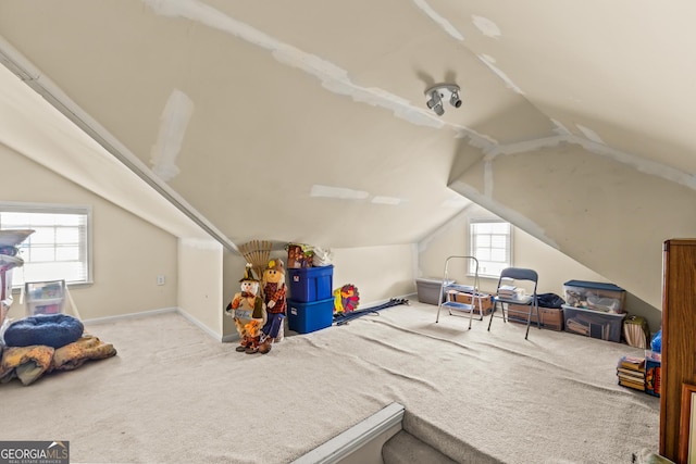 bonus room featuring baseboards, carpet flooring, and vaulted ceiling