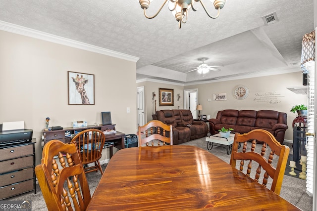 dining area with crown molding, a textured ceiling, carpet, ceiling fan with notable chandelier, and visible vents