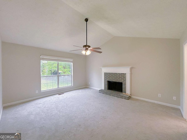unfurnished living room with vaulted ceiling, baseboards, light carpet, and a ceiling fan