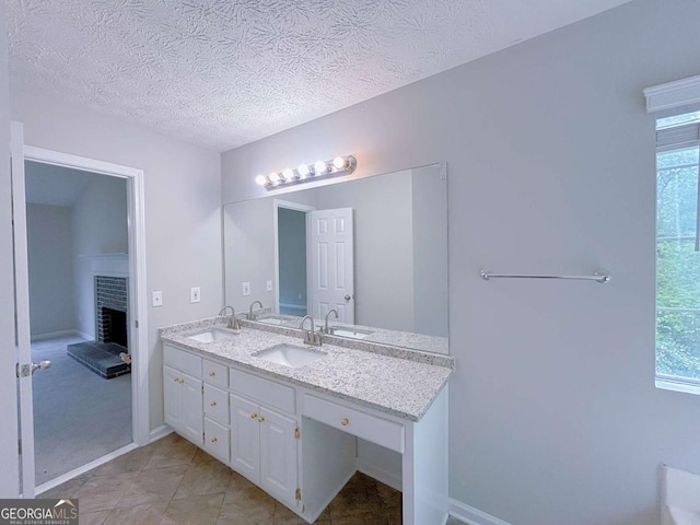 full bath with a sink and a wealth of natural light