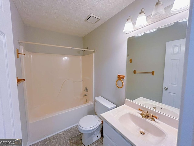 full bath with vanity, toilet, a textured ceiling,  shower combination, and visible vents