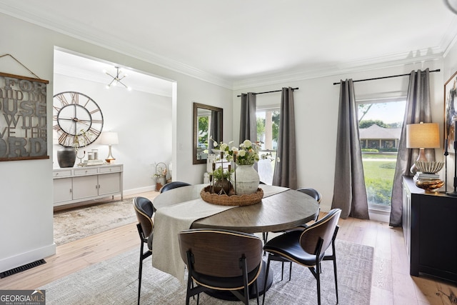 109 Old Virginia Cir, Jonesboro, GA 30236 - dining area featuring healthy amount of natural light, light wood finished floors, crown molding, and baseboards