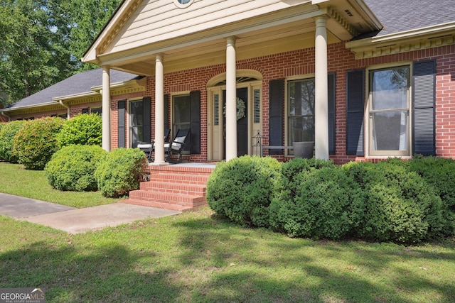 109 Old Virginia Cir, Jonesboro, GA 30236 - entrance to property featuring brick siding, a porch, a lawn, and a shingled roof