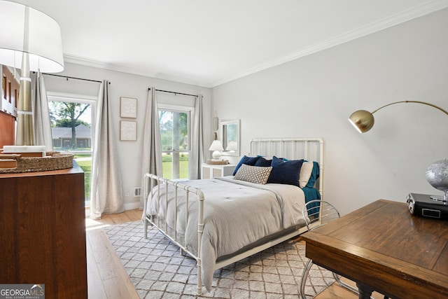 109 Old Virginia Cir, Jonesboro, GA 30236 - bedroom featuring light wood-style flooring and crown molding