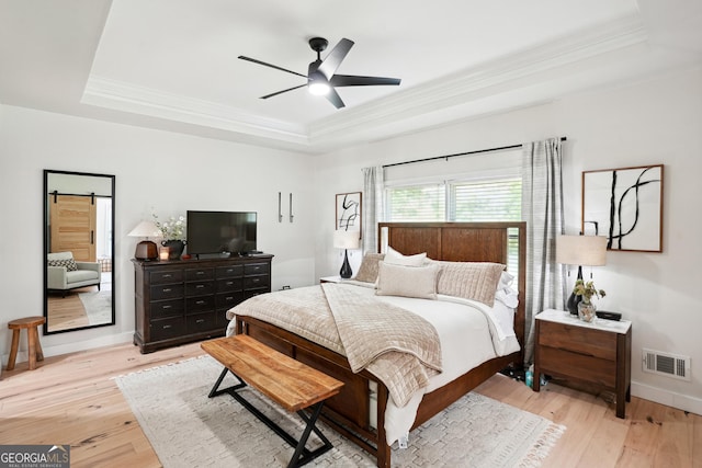 109 Old Virginia Cir, Jonesboro, GA 30236 - bedroom featuring a tray ceiling, crown molding, light wood-style floors, baseboards, and ceiling fan