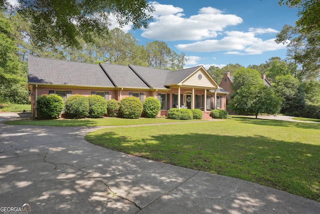 109 Old Virginia Cir, Jonesboro, GA 30236 - view of front facade featuring brick siding, a front yard, a porch, and a shingled roof