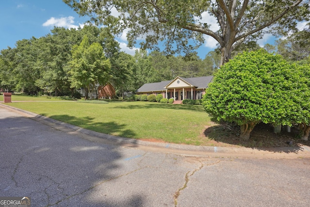 109 Old Virginia Cir, Jonesboro, GA 30236 - view of front facade with a front yard and view of wooded area