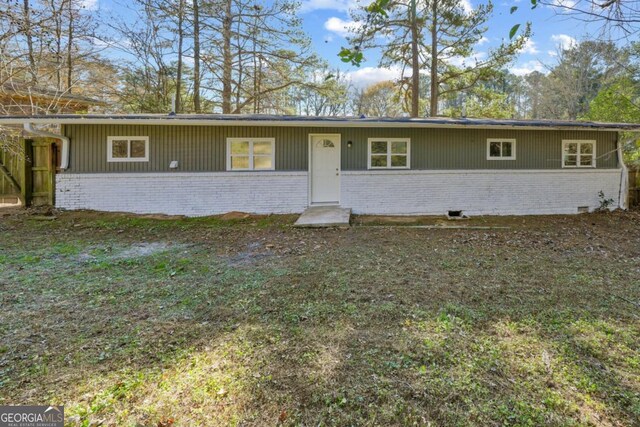 ranch-style home featuring crawl space and brick siding