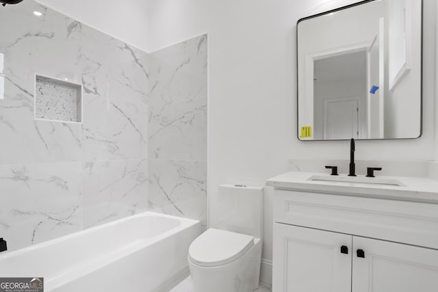 bathroom featuring vanity, shower / bathtub combination, and toilet