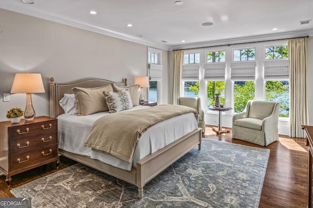 bedroom featuring recessed lighting, ornamental molding, and wood finished floors