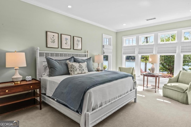 bedroom with carpet floors, ornamental molding, recessed lighting, and visible vents