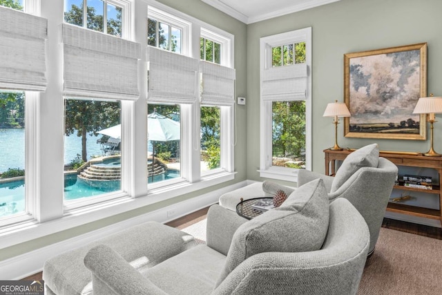 sitting room featuring baseboards and ornamental molding