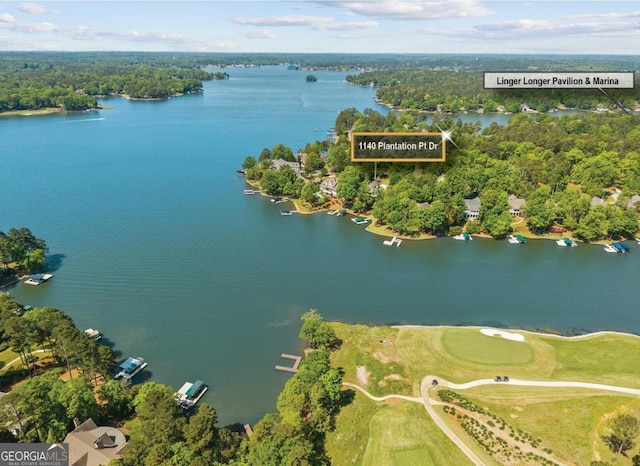bird's eye view with a water view and golf course view