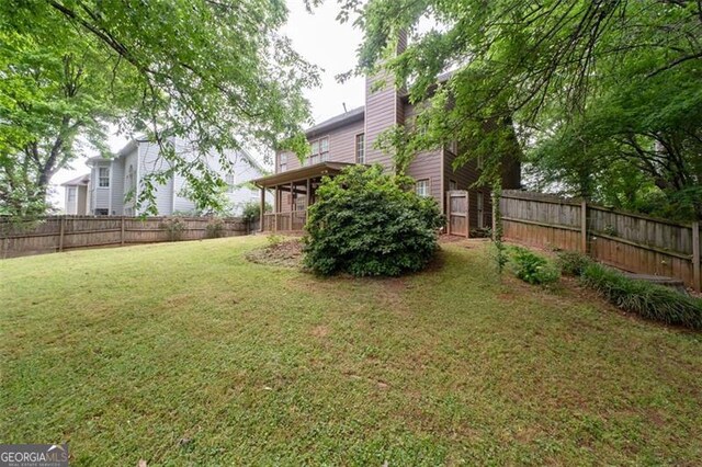 view of yard with a fenced backyard