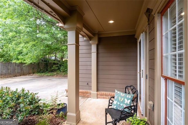 view of patio featuring fence