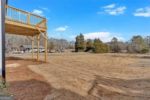 view of yard with a wooden deck