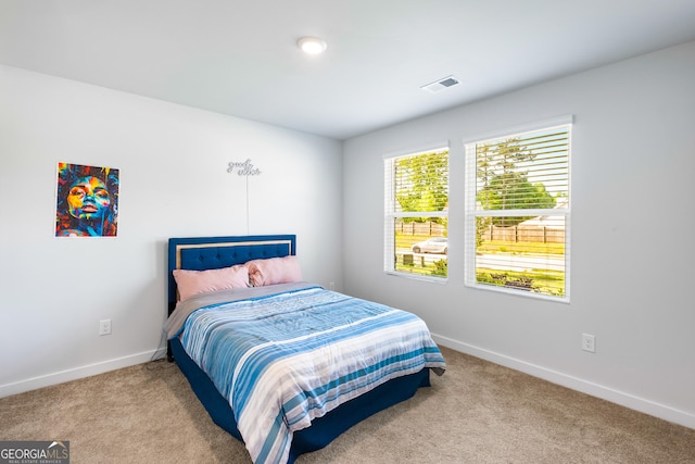 1341 Midnight Ride Ct, Hampton, GA 30228 - carpeted bedroom with baseboards and visible vents