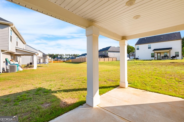 1341 Midnight Ride Ct, Hampton, GA 30228 - view of yard with a residential view, fence, a patio, and central AC unit