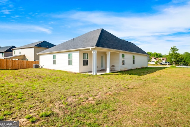 1341 Midnight Ride Ct, Hampton, GA 30228 - rear view of property featuring a yard, fence, cooling unit, and a patio area
