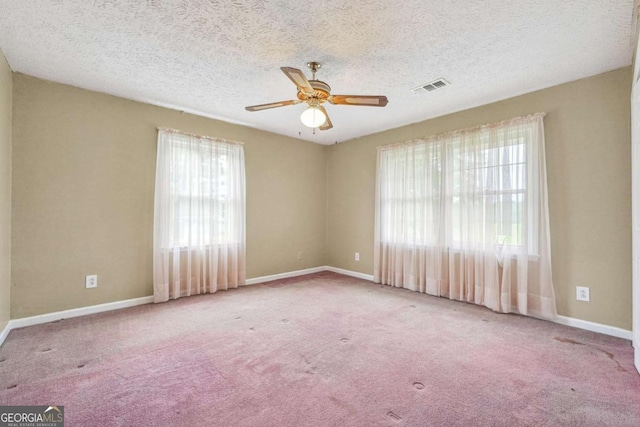 6545 Westbrook Rd, Gainesville, GA 30506 - carpeted empty room with visible vents, a textured ceiling, baseboards, and ceiling fan
