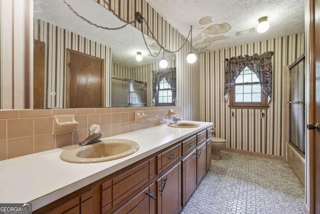 6545 Westbrook Rd, Gainesville, GA 30506 - bathroom with visible vents, a sink, a textured ceiling, and wallpapered walls