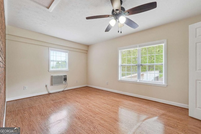 6545 Westbrook Rd, Gainesville, GA 30506 - empty room featuring a wall mounted AC, plenty of natural light, and wood finished floors