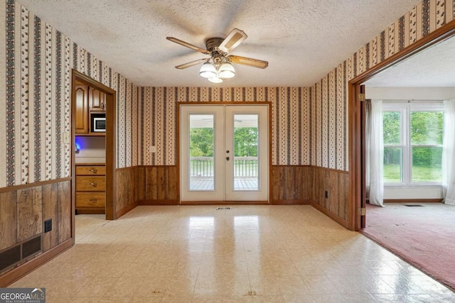 6545 Westbrook Rd, Gainesville, GA 30506 - empty room with wallpapered walls, a wealth of natural light, and french doors