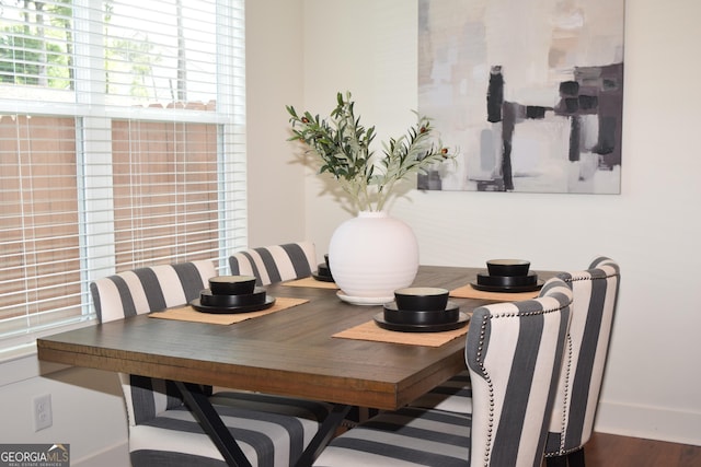 dining area with wood finished floors