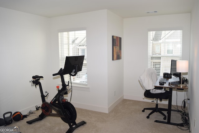 carpeted office featuring baseboards and visible vents