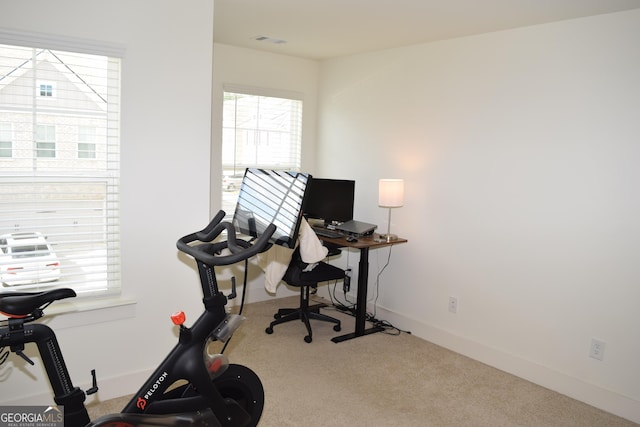 office featuring visible vents, carpet flooring, and baseboards