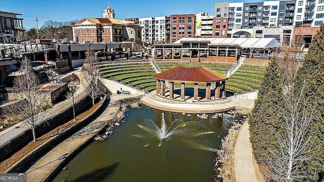 view of home's community with a water view and a gazebo