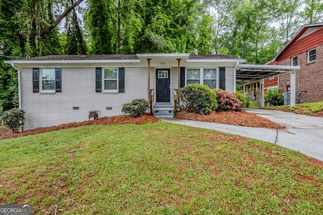 single story home featuring a front lawn, brick siding, crawl space, a carport, and driveway