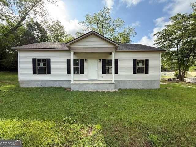 0 Worth St, Poulan, GA 31781 - view of front of property featuring a porch and a front yard