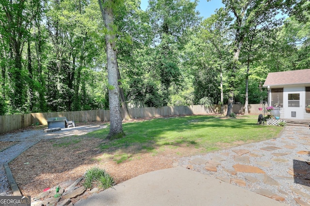view of yard with a fenced backyard