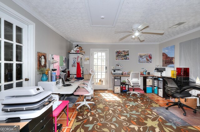home office with a ceiling fan, a textured ceiling, and visible vents