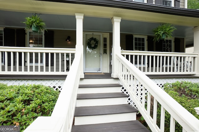 property entrance with covered porch