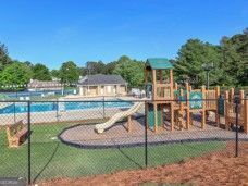 communal playground featuring fence