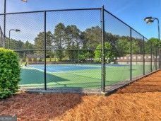 view of sport court with fence