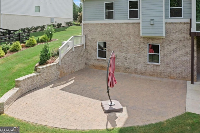 view of patio / terrace featuring fence